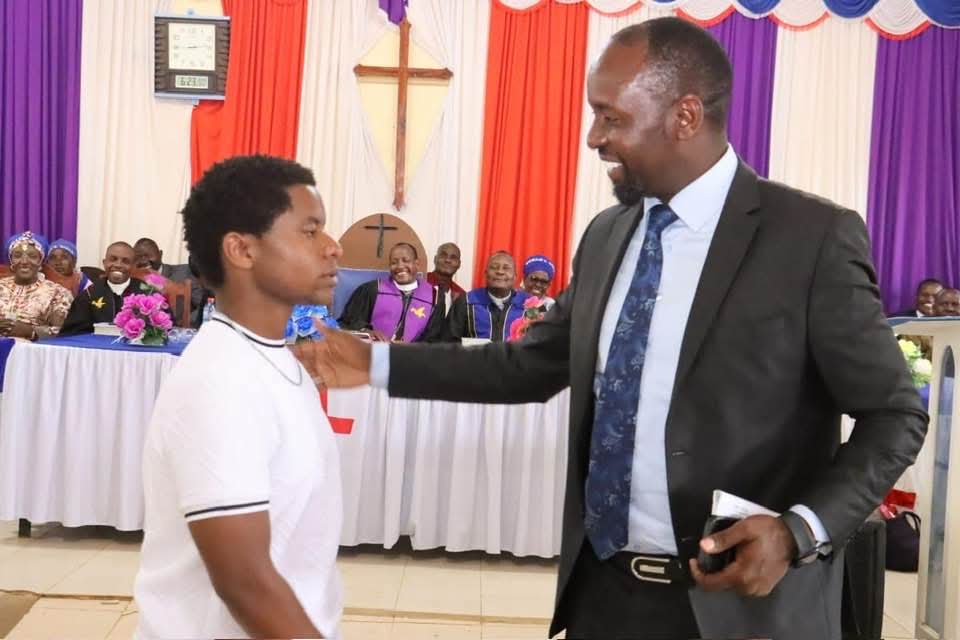 Wahome Koinange greeting a young supporter